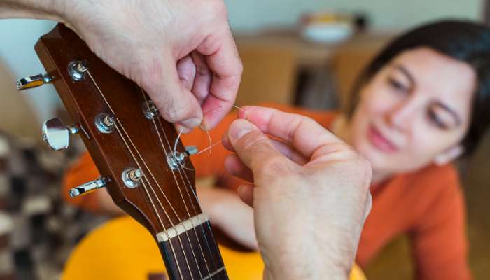 Changing strings on guitar